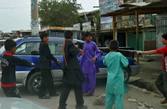Afghan children play with plastic guns on the second day of Eid al-Fitr, in Bagram city, Parwan province, north of Kabul, on August 31, 2011.