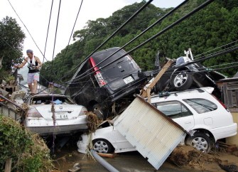 AFP - Vehicles are piled on top of one another on muddy ground after Typhoon Talas caused flash flooding in the town of Nachikatsuura, Wakayama prefecture, in western Japan on September 5, 2011.
