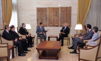 A photo released by the Syrian official news agency SANA shows Syrian President Bashar al-Assad (top L) meeting with International Committee of the Red Cross (ICRC) chief Jakob Kellenberger in Damascus on September 05, 2011