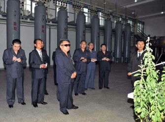This undated picture, released from North Korea's official Korean Central News Agency on September 9, 2011 shows North Korean leader Kim Jong Il (C) inspecting the Pyongyang Stevia Processing Factory in Pyongyang