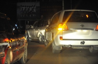 A convoy (R) of cars transporting unidentified persons enters Niamey on September 12, 2011.
