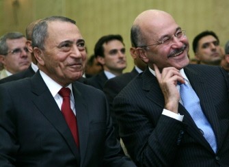 President of Iraq's Kurdistan Regional Government Braham Salih (R) sits next to Jordan's Prime Minister Maaruf Bakhit during a joint Kurdish-Jordanian Economic Forum held in the nothern Iraqi city of Arbil on September 11, 2011