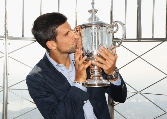 AFP - Novak Djokovic of Serbia poses with his US Open trophy atop the Empire State Building on September 13, 2011 in New York City, New York.