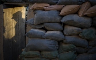AFP - A US army soldier of the 1st Platoon of Task Force 3-66 Bravo Company of 172. Infantry Brigade casts his shadow on a wall of a bunker on September 13, 2011 in the Forward Operating Base Kuschamond.