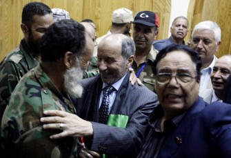 Libya's Libya's National Transitional Council Leader Mustafa Abdel Jalil is greated by the dignitaries of the town of Zawiya on September 14, 2011.