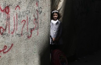 AFP - A Palestinian school girl pulls her school bag in the al-Shati refugee camp in Gaza City on September 15, 2011.