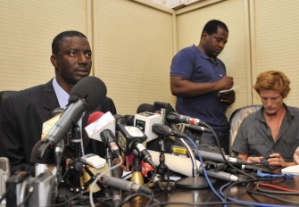 Marou Amadou (L), Nigerian Minister of Justice and government spokesman, looks on during a press conference on the Libya conflict, on September 16, 2011