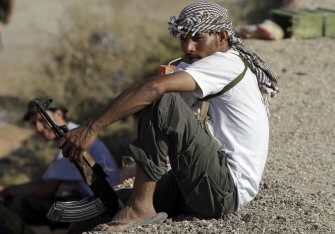 AFP - A Libyan National Transition Council fighter sips an orange drink at an outpost close to the frontline of the Bani Walid Kadhafi hold-out, southeast of Tripoli on September 17, 2011, as forces of Libya's new leadership battled diehard remnants of the fallen regime in the desert oasis and the coastal city of Sirte.
