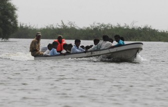 AFP - Pakistani Navy personnel rescue flood affected peoples from the flooded area of Kaloi district in Tharparkar on September 17, 2011.