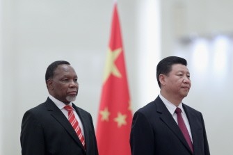 Chinese Vice President Xi Jinping (R) and South Africa's Vice President Kgalema Motlanthe listen to their national anthems during a welcoming ceremony inside the Great Hall of the People on September 28, 2011 in Beijing.