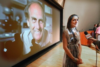 AFP - Alexis Steinman, daughter of deceased 2011 Nobel Prize in medicine winner Ralph Steinman, speaks at a press conference in front of a photo of her father at Rockefeller University on October 3, 2011 in New York City.