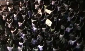 An image grab from footage made available on YouTube shows Syrian anti-regime protesters shouting slogans against President Bashar al-Assad and declaring support to the newly-launched Syrian National Council in the flashpoint city of Homs on October 3, 2011.