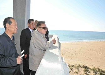 This undated photo released by North Korea's official Korean Central News Agency (KCNA) on October 4, 2011 shows North Korean leader Kim Jong-Il (R) as he visits the construction site of Tanchon Port in South Hamgyong Province.