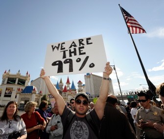 A man who gave only his first name Rich, a protester affiliated with the Occupy Las Vegas movement, marches on the Las Vegas Strip October 6, 2011 in Las Vegas, Nevada.