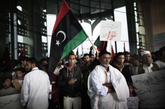 Dozens of Libyans whose houses were damaged during recent fighting protest to demand the reconstruction of their homes in Tripoli on October 10, 2011
