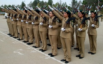 A handout picture released by the Syrian Arab News Agency (SANA) shows Syrian female cadets salute during their graduation ceremony in Damascus on October 12, 2011