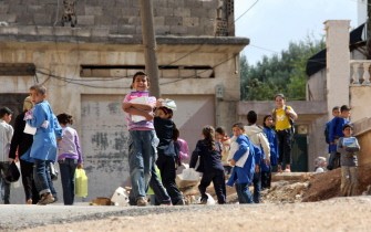 AFP - Syrian students return home from their school in the flashpoint city of Rastan in the central Homs province, about 180 kilometres from Damascus, on October 13, 2011. Rastan, a gateway to the country's north, has been the focus of security force operations against anti-regime dissent for several weeks.