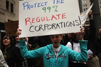 AFP - "Occupy Wall Street" protesters march in front of the Chase Manhattan Bank headquarters on October 12, 2011 in New York City.