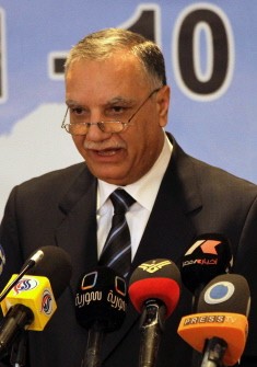 Syrian Prime Minister Adel Safar adresses the opening of the National Forum for Economic Dialogue in Damascus on October 30, 2011.