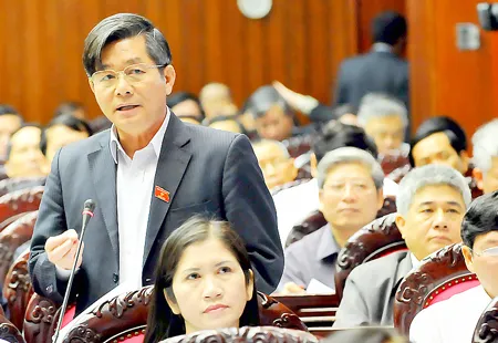 Bộ trưởng Bộ KH-ĐT Bùi Quang Vinh phát biểu tại diễn đàn Quốc hội. Ảnh: Minh Điền