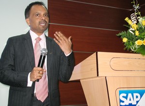 Srinivas Adimulam gestures as he announces the grand opening of SAP Asia Vietnam in Ho Chi Minh City November 1, 2011 (Photo: Tuong Thuy)