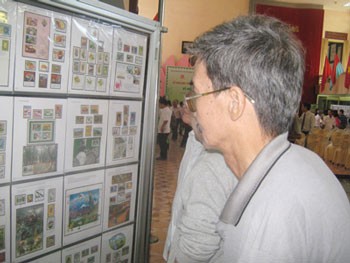 Visitors view the wide collection of stamps at the exhibition.