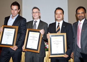 (From left) Representatives of Vietnamese-German University, RMIT Vietnam, and University of Economics and Law receive SAP University Alliances Program certificates in Ho Chi Minh City Dec. 8, 2011. SAP Vietnam’s Srinivas Adimulam stands on the right (Photo: T. Thuy)