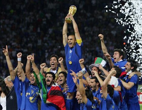 (File) Italy captain Fabio Cannavaro holds up the 2006 FIFA World Cup trophy in Germany, together with his teammates around