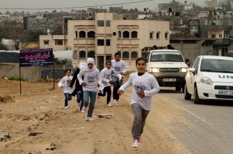 Participants compete in the UN-sponsored Gaza marathon in Gaza City on March 1, 2012. Thousands of runners braved temperatures hovering just above zero degrees centigrade to take part in the impoverished Palestinian territory's second-ever marathon.