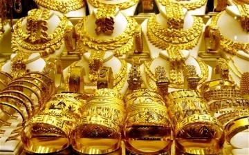 Gold rises again marginally ảnh 1