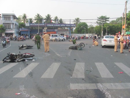 Police investigate the scene of the accident at the crossroad in the southern province of Dong Nai
