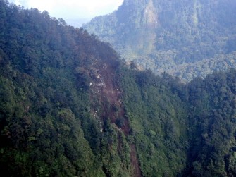 In this photograph released on May 10, 2012 by the Indonesian Air Force and taken by Indonesian Air Force rescue personnel aboard a helicopter on May 10, 2012, debris of plane crash from a Russian Sukhoi Superjet 100 is seen on the slope of Salak Mountain Western Java province.