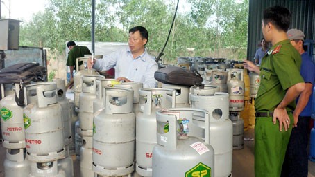 Police conduct a raid at the Gas Viet Company facility