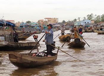 The file phto shows life a floating market in the Mekong Delta in Vietnam.
