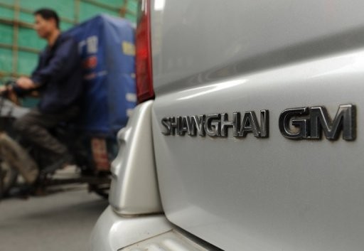 A Shanghai General Motors (GM) vehicle is parked on a street in Shanghai in May 2012.