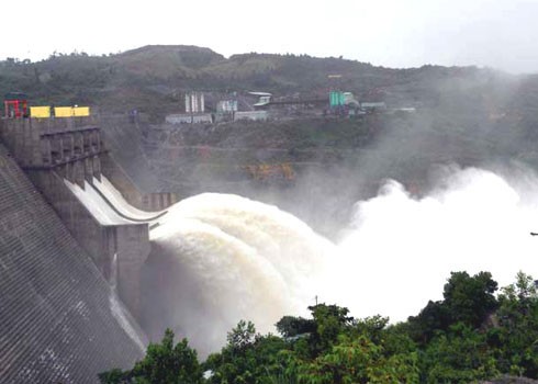 The file photo shows water flowing through Song Tranh 2 hydro-electric power plant dam during heavy rains in September.