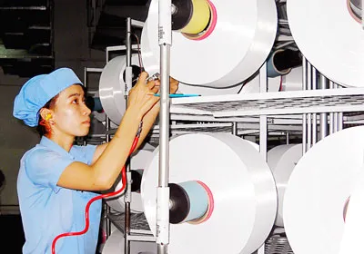 Sản xuất sợi của Công ty cổ phần sợi Thế Kỷ tại KCX Tây Bắc Củ Chi).