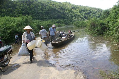 The filed photo shows 28 National Highway which links Lam Dong province with Dak Nong being flooded by 3rd Dong Nai Hydropower Plant .