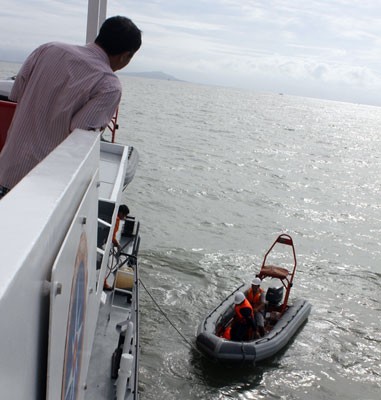 A rescue team searching for victims in Can Gio territorial waters