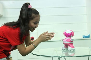 The high-tech toy robot listens to the hand clapping sound and moves her body.