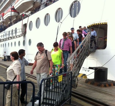 Holiday-makers arrive in Vietnam on five-star cruise liner ‘Celebrity Millennium’ that docked at Tan Cang Cai Mep Port in the southern province of Ba Ria-Vung Tau on December 13
