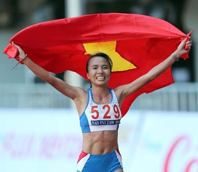 Happy face of athlete Pham Thi Binh after she won a gold medal for Vietnam (Photo:SGGP)