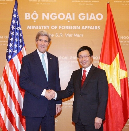 Deputy Prime Minister and Foreign Minister Pham Binh Minh meets US Secretary of State John Kerry in Ha Noi yesterday.—VNA/VNS Photo Thong Nhat