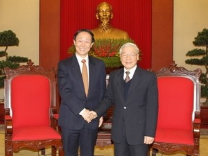 Party General Secretary Nguyen Phu Trong (R) and Wang Jiarui, Vice Chairman of the National Committee of the Chinese People’s Political Consultative Conference and head of the Communist Party of China (CPC) Central Committee’s International Department