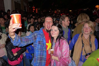 Locals and foreign visitors enjoy New Year 2014 in Hoi An.