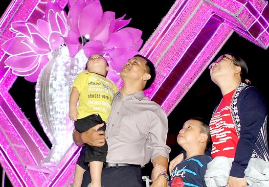 People enjoy firework display in Ho Chi Minh City.