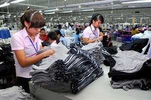 Workers put the final touches on clothes at French-owned Scavi Hue Garment Company in Hue (Photo: VNA)