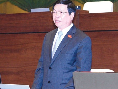 Minister of Industry and Trade Vu Huy Hoang at the NA question and answer session. (Photo: VNA/VNS)