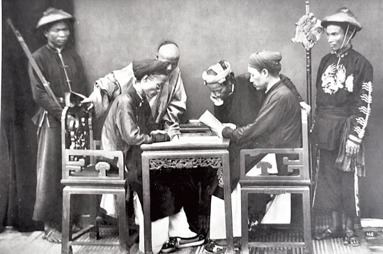 Vietnamese and Chinese Confucian scholars, and blue militiaman (Linh Kho Xanh) at the French Embassy in Hanoi in the 1884-1886 period