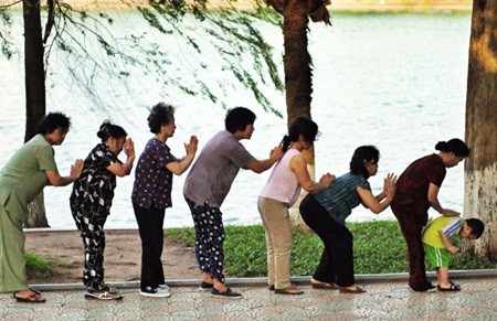 Senior citizens do morning exercises at the Hoan Kiem (Sword) Lake in Ha Noi. In the next 10 years, 10 million Vietnamese will become senior citizens. — VNS Photo Viet Thanh